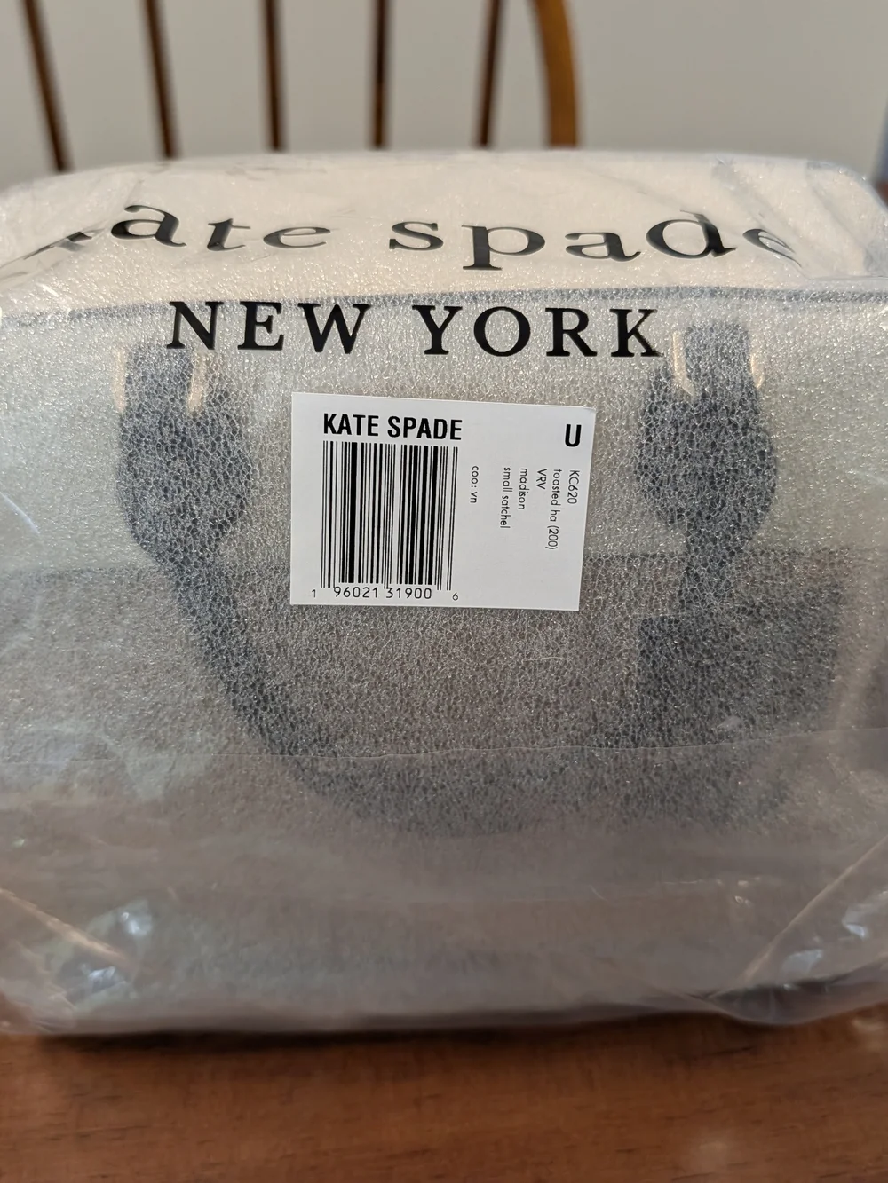 kate spade two-tone cream and beige satchel with black handles